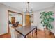 Dining room featuring hardwood floors, a table with chairs, and a stylish chandelier at 2320 Tilson Cir, Decatur, GA 30032