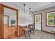 Bright eat-in kitchen featuring a cozy bar, hardwood floors and a view to the living room at 2320 Tilson Cir, Decatur, GA 30032