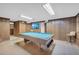 Spacious game room features a pool table, wood paneled walls, and a mounted TV at 2320 Tilson Cir, Decatur, GA 30032