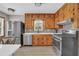 Bright kitchen with stainless steel appliances, white counters and wood cabinets at 2320 Tilson Cir, Decatur, GA 30032