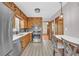 Kitchen featuring modern appliances, wooden cabinetry, and a breakfast bar with seating at 2320 Tilson Cir, Decatur, GA 30032