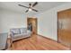 Spacious living room with hardwood floors, a ceiling fan and a view into the kitchen at 2320 Tilson Cir, Decatur, GA 30032