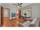 Comfortable living area featuring wood floors, a ceiling fan, and a desk at 2320 Tilson Cir, Decatur, GA 30032