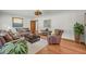 Living room featuring hardwood floors, neutral walls, and comfortable seating with stylish decor at 2320 Tilson Cir, Decatur, GA 30032
