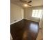 Cozy bedroom with hardwood floors and a bright window at 888 Beecher Sw Ct, Atlanta, GA 30311