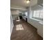 Well-lit kitchen featuring white cabinets and modern appliances at 888 Beecher Sw Ct, Atlanta, GA 30311
