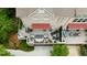 An aerial view showcasing a well-furnished deck with multiple seating areas, sun loungers, and lush greenery at 1354 Fernwood Ne Cir, Brookhaven, GA 30319