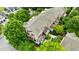 A high-angle shot showcases the property surrounded by lush greenery, a charming exterior, and multiple outdoor spaces at 1354 Fernwood Ne Cir, Brookhaven, GA 30319