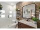Modern bathroom featuring a glass shower, exposed brick, and contemporary fixtures at 1354 Fernwood Ne Cir, Brookhaven, GA 30319