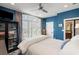 Comfortable bedroom with large windows, blue accent wall, and a cozy, inviting atmosphere at 1354 Fernwood Ne Cir, Brookhaven, GA 30319