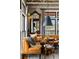 Cozy breakfast nook features a leather banquette, round table, stylish lighting, and large windows for natural light at 1354 Fernwood Ne Cir, Brookhaven, GA 30319