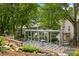 Common area featuring an outdoor patio with a pergola, tables, benches, and rock retaining walls at 1354 Fernwood Ne Cir, Brookhaven, GA 30319