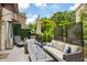 Outdoor deck featuring lounge chairs, a sofa with pillows, a fire table, privacy screens, and a sun umbrella at 1354 Fernwood Ne Cir, Brookhaven, GA 30319