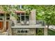 A well-maintained home featuring a small balcony, large windows, and landscaping at 1354 Fernwood Ne Cir, Brookhaven, GA 30319