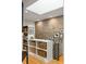 Hallway featuring built-in shelving and stylish decor with access to the upper and lower levels at 1354 Fernwood Ne Cir, Brookhaven, GA 30319