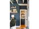 Hallway with shelving, cabinet, and an open doorway to another room with shelving at 1354 Fernwood Ne Cir, Brookhaven, GA 30319