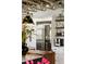 Modern kitchen features stainless steel appliances, open shelving with decor, and white cabinets for a sleek design at 1354 Fernwood Ne Cir, Brookhaven, GA 30319