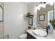Elegant powder room with white subway tile, a vessel sink, and a marble countertop at 1354 Fernwood Ne Cir, Brookhaven, GA 30319