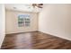 Bright bedroom featuring beautiful hardwood floors and a ceiling fan for added comfort at 257 Se Ashland Park Se Ct, Lawrenceville, GA 30045