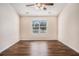 Bright bedroom featuring beautiful hardwood floors and a ceiling fan for added comfort at 257 Se Ashland Park Se Ct, Lawrenceville, GA 30045
