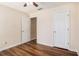 Bedroom showing closet doors and updated flooring at 257 Se Ashland Park Se Ct, Lawrenceville, GA 30045