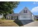 Attractive single-story house with a well-kept yard, an attached two-car garage, and a welcoming porch at 257 Se Ashland Park Se Ct, Lawrenceville, GA 30045