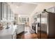 Eat-in kitchen with stainless refrigerator and large windows with natural light at 257 Se Ashland Park Se Ct, Lawrenceville, GA 30045
