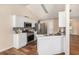 Bright kitchen features stainless appliances, bar seating, and modern tile backsplash at 257 Se Ashland Park Se Ct, Lawrenceville, GA 30045
