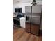 Modern kitchen with stainless steel appliances, including a refrigerator, range, and microwave at 257 Se Ashland Park Se Ct, Lawrenceville, GA 30045