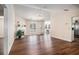 Bright living room with wood floors, a charming fireplace, and large windows at 257 Se Ashland Park Se Ct, Lawrenceville, GA 30045