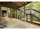 Back patio with an exterior staircase surrounded by greenery, offering outdoor living space at 3227 Collier Gate Se Ct, Smyrna, GA 30080