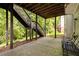 Back patio with an exterior staircase with a peaceful backyard view at 3227 Collier Gate Se Ct, Smyrna, GA 30080