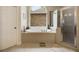 Bathroom featuring a tub, walk-in shower, and arched window at 3227 Collier Gate Se Ct, Smyrna, GA 30080