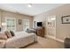Bedroom featuring neutral walls, carpet, a bed, and a view into the bathroom at 3227 Collier Gate Se Ct, Smyrna, GA 30080