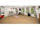 Spacious bonus room with neutral walls, carpet, ceiling fan, and large windows at 3227 Collier Gate Se Ct, Smyrna, GA 30080