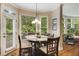 Bright dining area with natural light, an adjacent deck, and a serene view of the wooded back yard at 3227 Collier Gate Se Ct, Smyrna, GA 30080