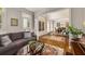 Comfortable living room with hardwood floors that opens to the dining room at 3227 Collier Gate Se Ct, Smyrna, GA 30080