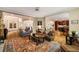 Expansive living room with open floor plan, hardwood floors, and seamless flow to the kitchen and dining area at 3227 Collier Gate Se Ct, Smyrna, GA 30080