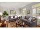 Cozy living room with comfortable seating, hardwood floors and natural light at 3227 Collier Gate Se Ct, Smyrna, GA 30080