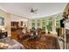 Cozy living room featuring a fireplace, large windows, and an open floor plan with hardwood floors at 3227 Collier Gate Se Ct, Smyrna, GA 30080