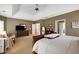 Large main bedroom featuring a ceiling fan and doorway leading to another room at 3227 Collier Gate Se Ct, Smyrna, GA 30080