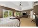 Large main bedroom featuring a ceiling fan and a view to the backyard at 3227 Collier Gate Se Ct, Smyrna, GA 30080