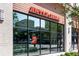 Exterior of Jenni's Ice Creams, showcasing a modern design with large glass windows and inviting signage at 3227 Collier Gate Se Ct, Smyrna, GA 30080