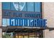 Modern storefront for Good Game Topgolf Swing Suite with Eat Play Connect sign in blue neon lights at 3227 Collier Gate Se Ct, Smyrna, GA 30080