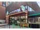 Inviting exterior of Wahlburgers restaurant, showcasing a modern design with Beer Wine Cocktails sign at The Battery at 3227 Collier Gate Se Ct, Smyrna, GA 30080