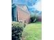 Backyard with mature bushes and trees at 401 Autumn Leaf Way, Norcross, GA 30093