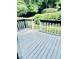 Deck features wood construction and view of mature bushes and trees at 401 Autumn Leaf Way, Norcross, GA 30093