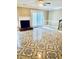 Open living area with fireplace, beautiful flooring, and view of patio at 401 Autumn Leaf Way, Norcross, GA 30093