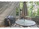 Back deck with table and chairs, perfect for outdoor dining and entertaining at 4246 Loch Highland Ne Pkwy, Roswell, GA 30075