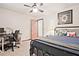 Bedroom with ceiling fan, closet door, desk and large window at 4246 Loch Highland Ne Pkwy, Roswell, GA 30075